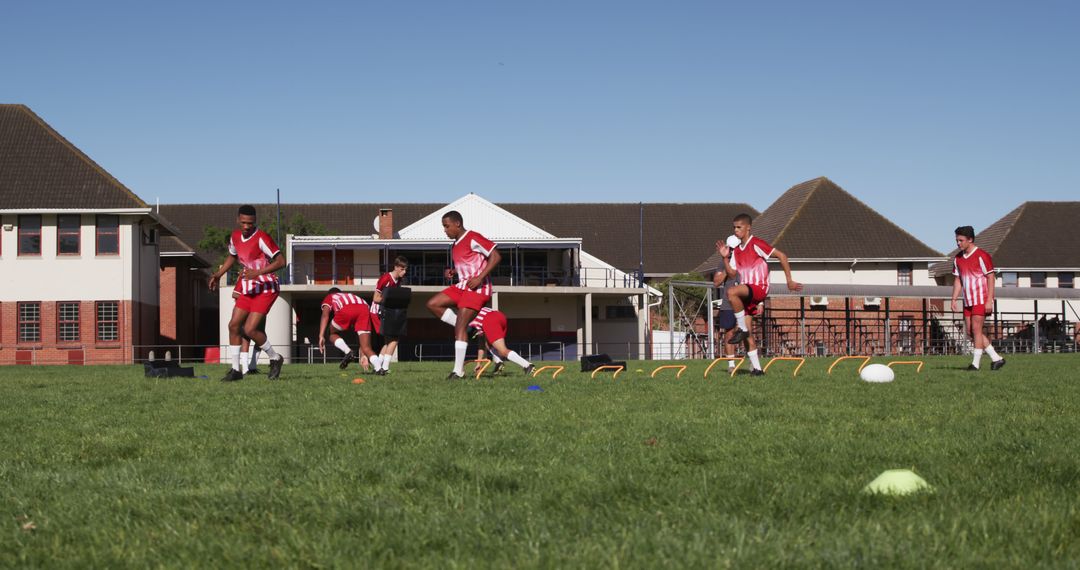 Soccer Team Practicing Agility Drills on Field - Free Images, Stock Photos and Pictures on Pikwizard.com