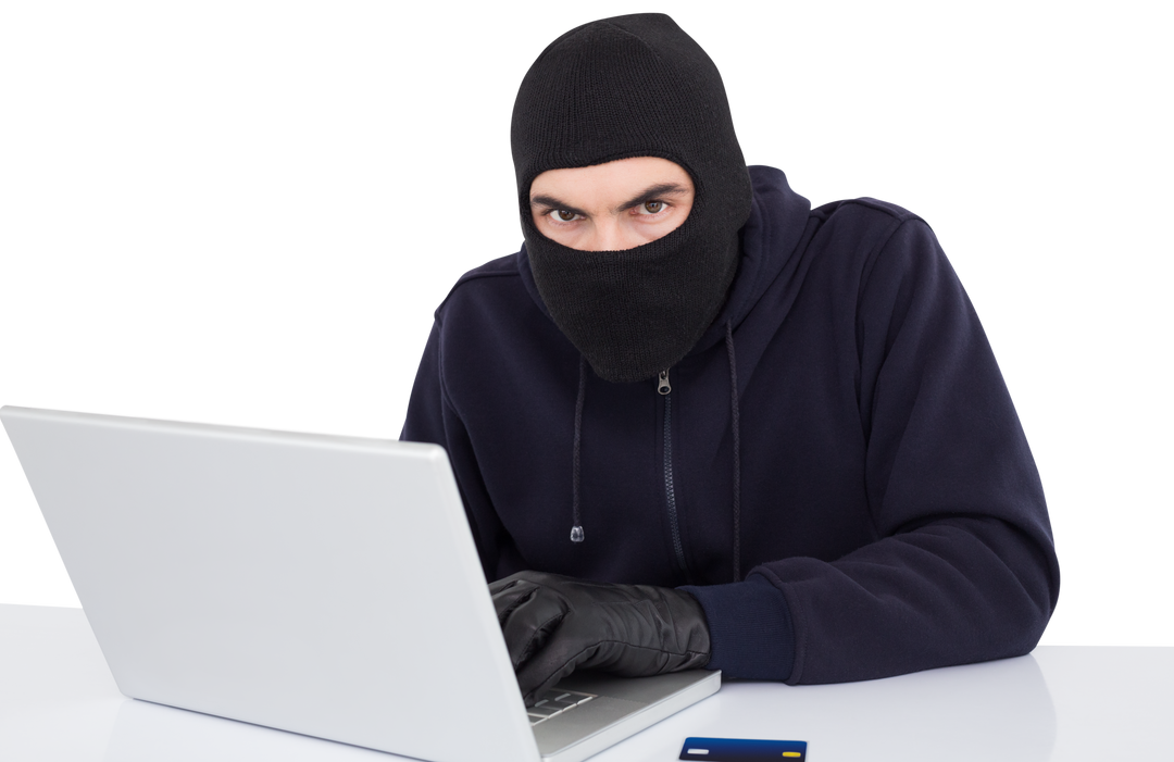 Hacker in Balaclava Mask Hacking on Laptop, Card in View, Transparent Background - Download Free Stock Images Pikwizard.com