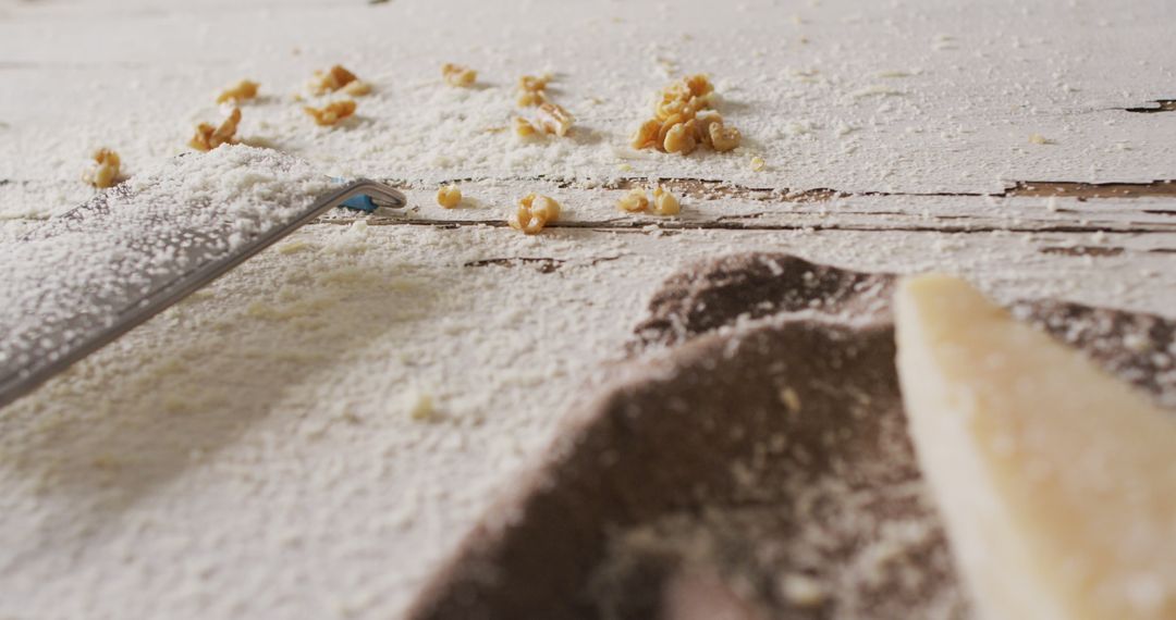 Shredded Parmesan Cheese on Rustic Wooden Table with Knife and Walnut Pieces - Free Images, Stock Photos and Pictures on Pikwizard.com