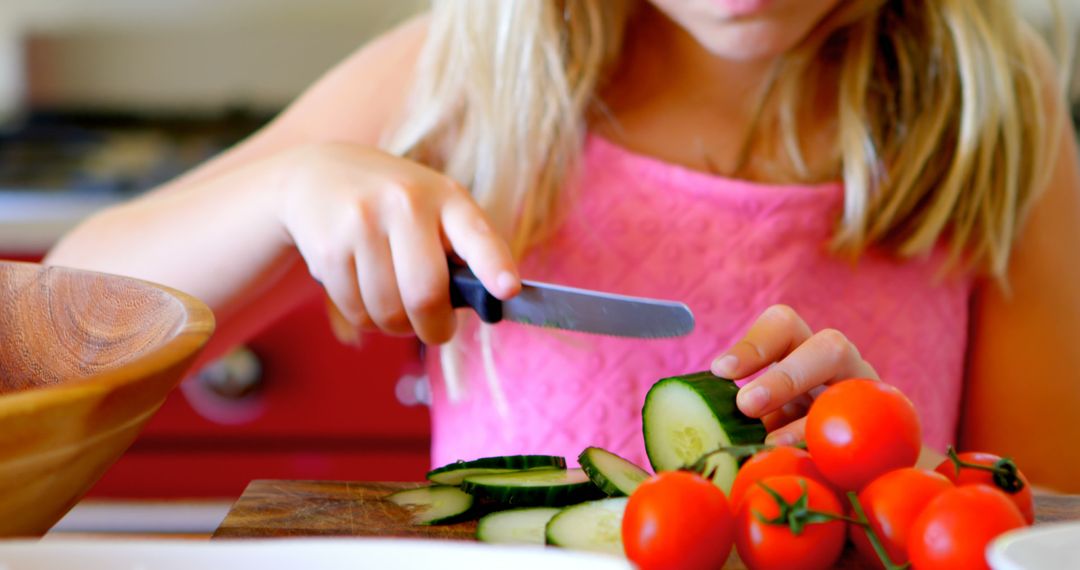 Young Girl Learning to Cook by Slicing Fresh Vegetables - Free Images, Stock Photos and Pictures on Pikwizard.com