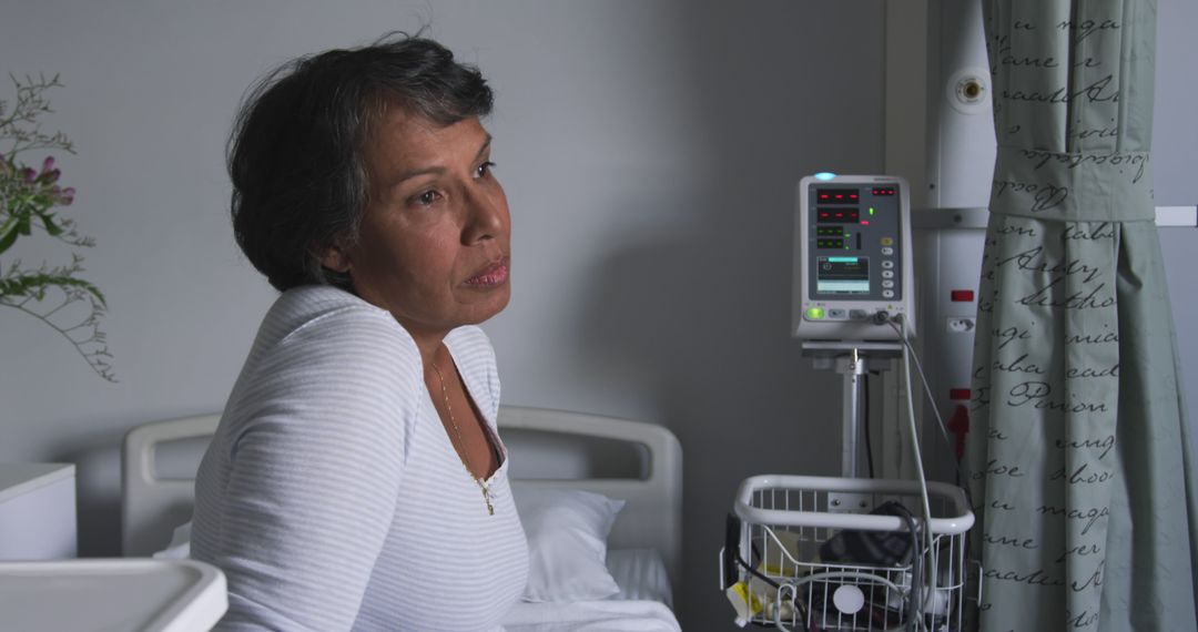 Mature Woman in Hospital Room Resting in Bed with IV Drip - Free Images, Stock Photos and Pictures on Pikwizard.com