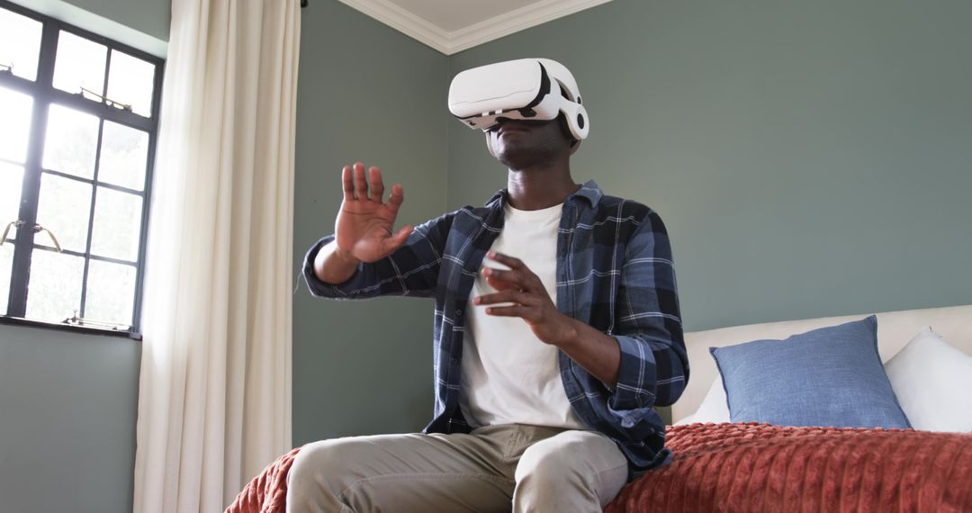 Man Experiencing Virtual Reality in Cozy Bedroom Setting
