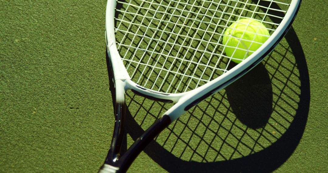 Tennis Racket and Ball Close-Up on Green Court - Free Images, Stock Photos and Pictures on Pikwizard.com