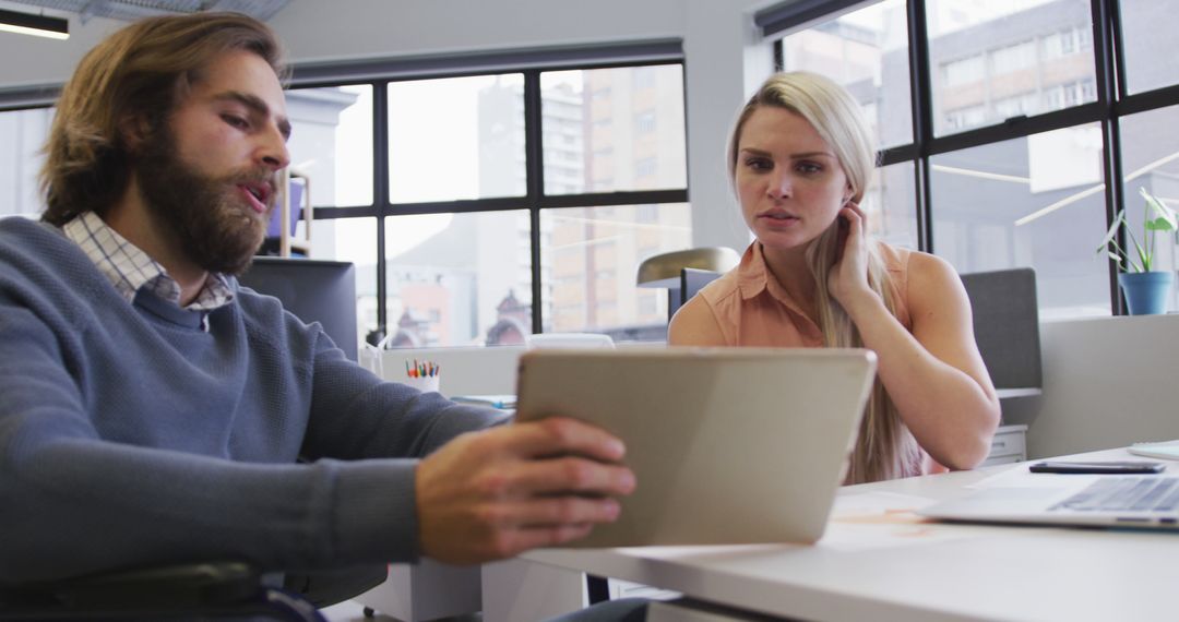 Business Team Discussing Digital Strategy in Modern Office