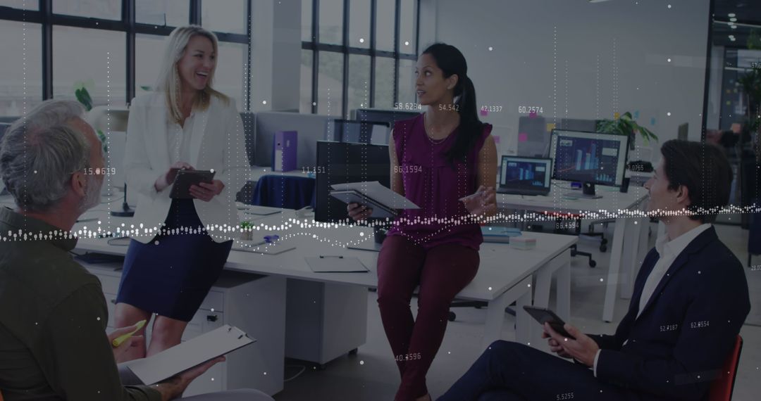 Diverse Team Engaging in Business Strategy Discussion in Modern Office