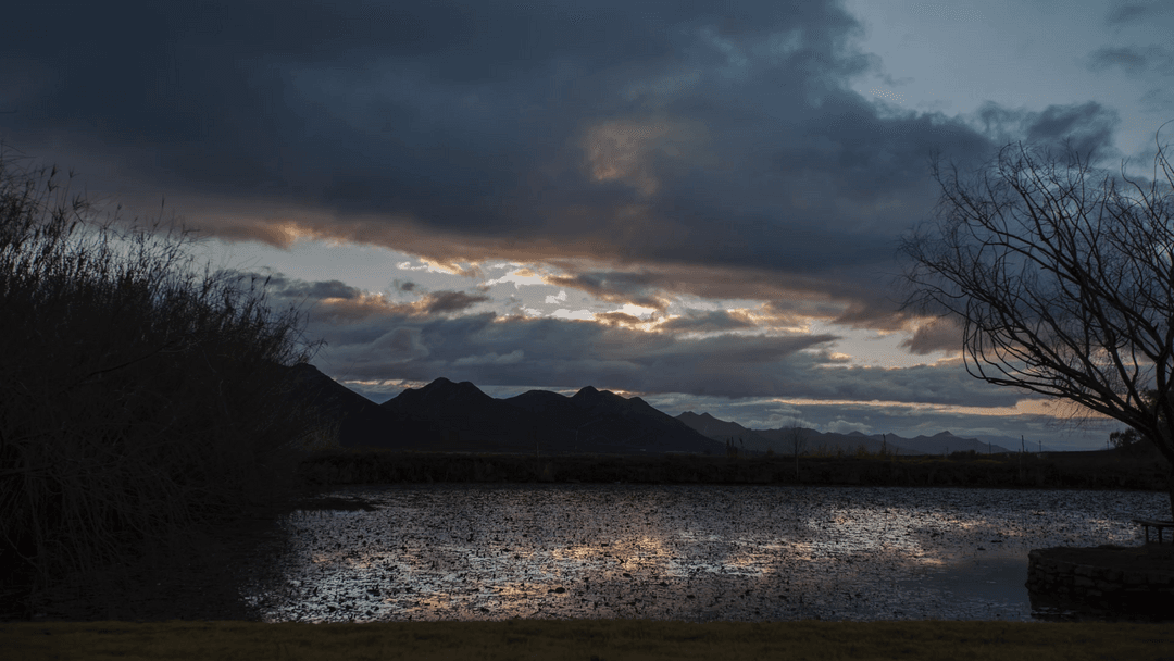 Serene Transparent Sky Reflecting in Water at Dusk