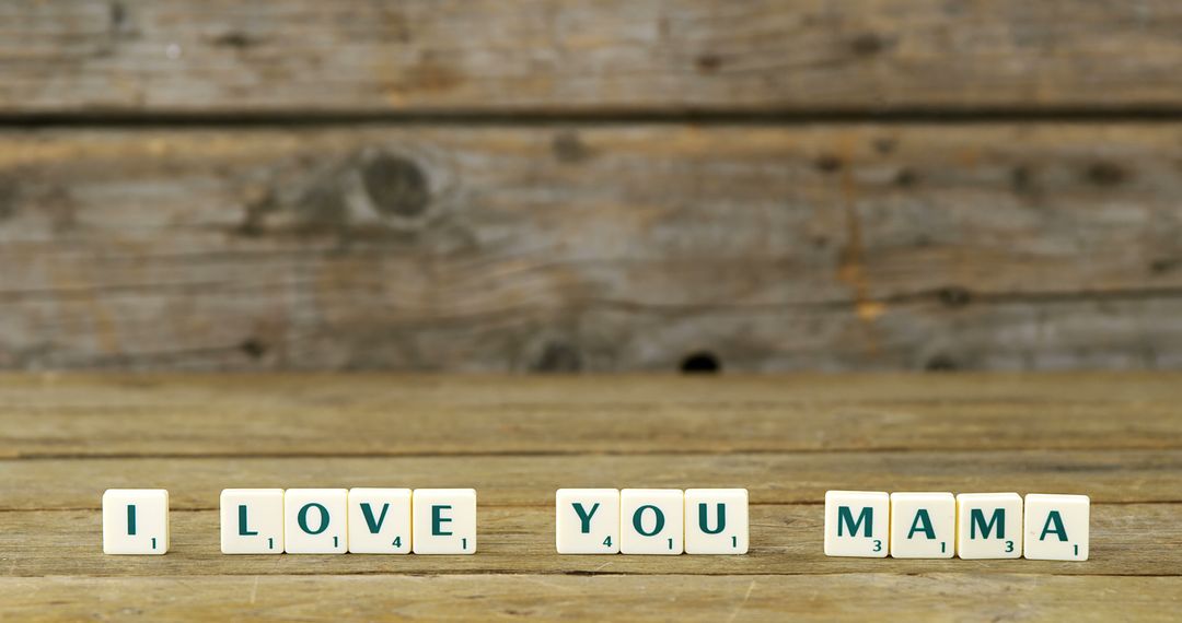 Scrabble tiles spell out I LOVE YOU MAMA against a rustic wooden background, with copy space - Free Images, Stock Photos and Pictures on Pikwizard.com