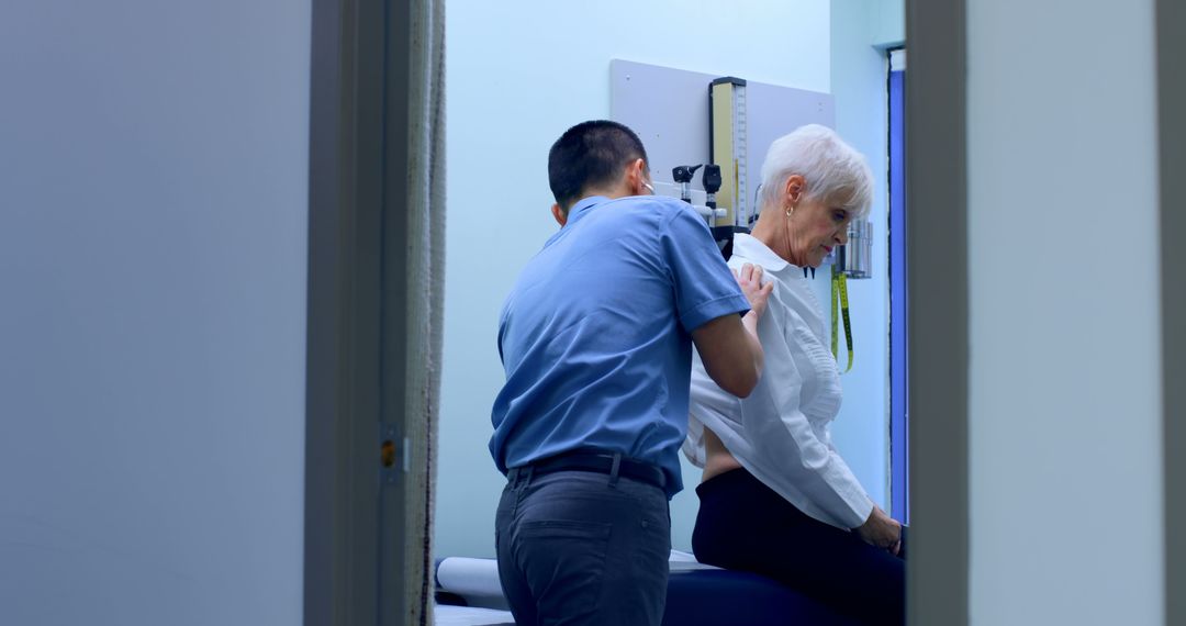 Doctor examining senior patient in medical office - Free Images, Stock Photos and Pictures on Pikwizard.com