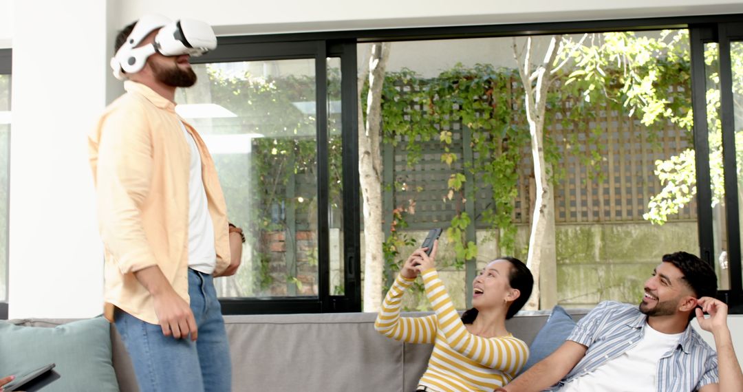 Diverse Friends Experiencing Virtual Reality Together at Home