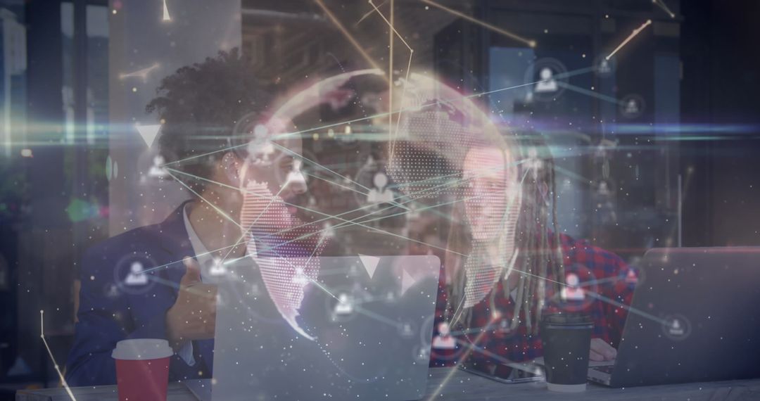 Coworkers Collaborating on a Digital Network Concept in Modern Office