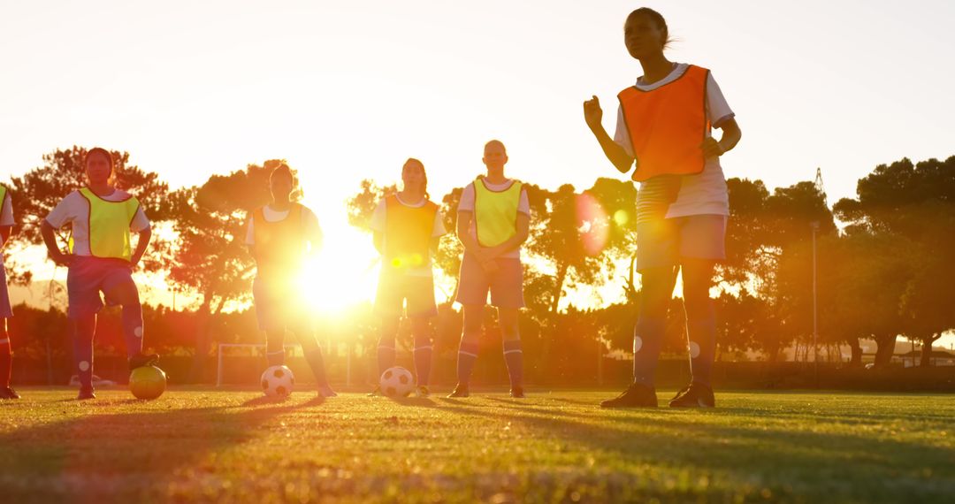 Female Soccer Team Practicing at Sunset - Free Images, Stock Photos and Pictures on Pikwizard.com