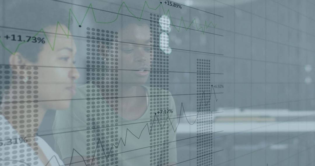 Diverse Professionals Analyzing Financial Data Projections in Modern Office