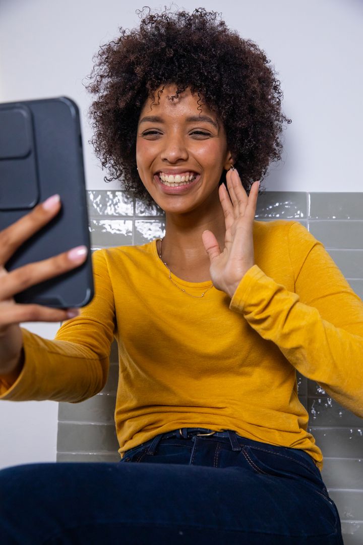 Cheerful Woman Engaging in Video Call with Tablet