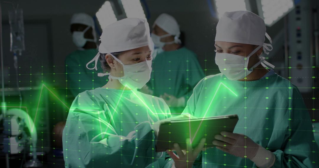 Surgeons Analysing Data on Digital Tablet in Operating Room