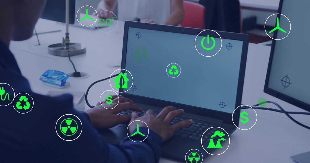 Typing worker on laptop with green sustainability icons, energy efficiency and teamwork