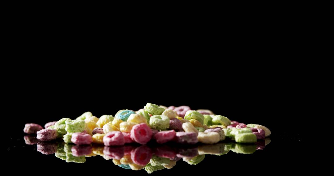 Close-up of froot loops on black background 4k - Free Images, Stock Photos and Pictures on Pikwizard.com