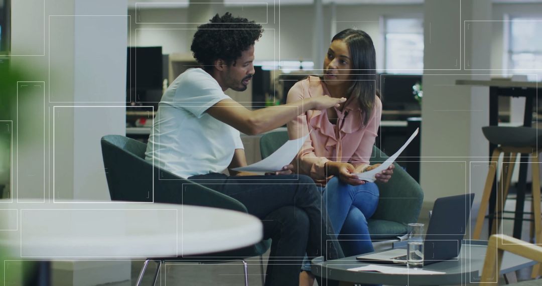 Colleagues Discussing Work with Digital Interface Overlay in Modern Office