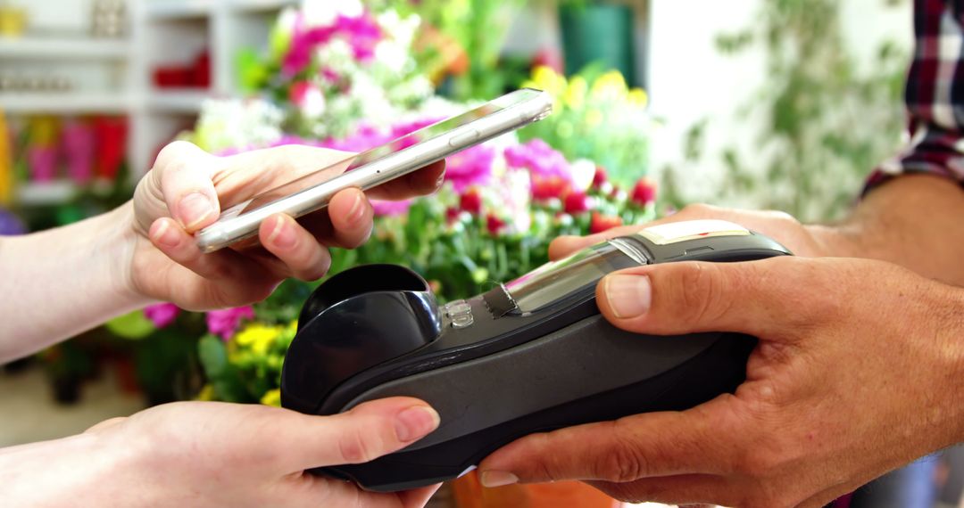 Contactless Payment with Mobile Phone in Flower Shop - Free Images, Stock Photos and Pictures on Pikwizard.com