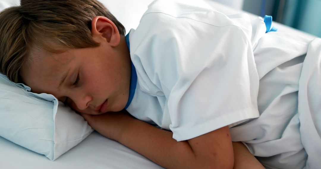 Young Child Sleeping Peacefully in Hospital Bed - Free Images, Stock Photos and Pictures on Pikwizard.com