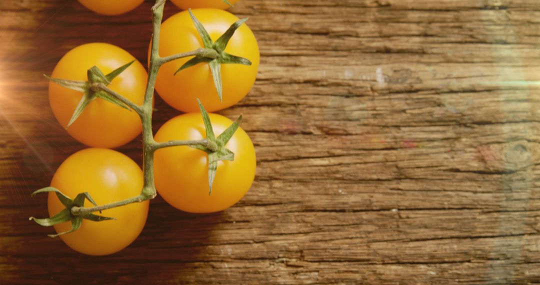 Fresh Yellow Tomatoes on Rustic Wooden Surface