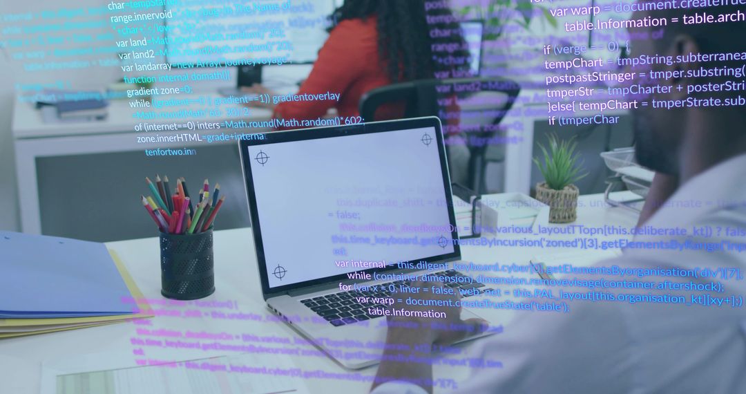 Innovative Teamwork in Modern Office with Coding on Display