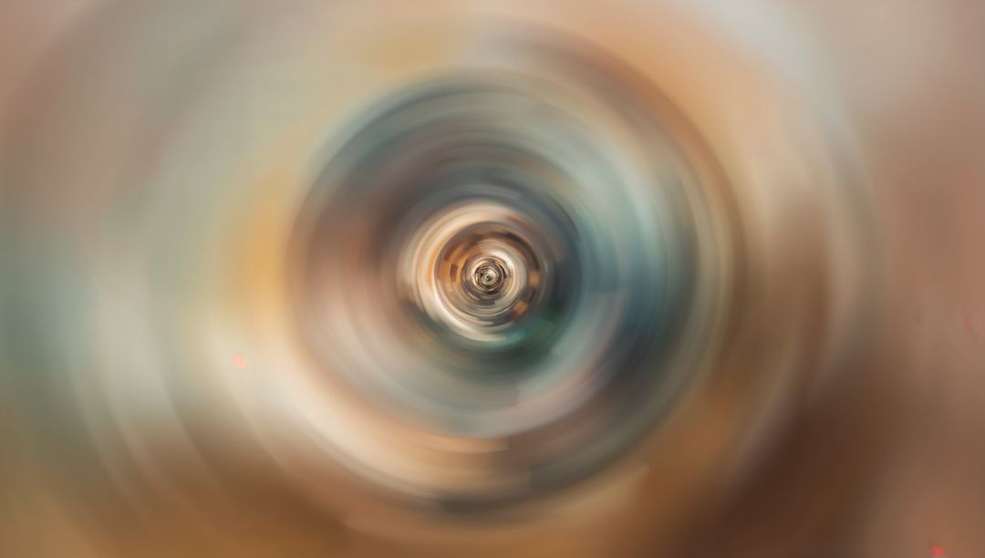 Spinning Concentric Vortex with Metallic Core Radiating Warm Teal Motion Blur Depth Energy