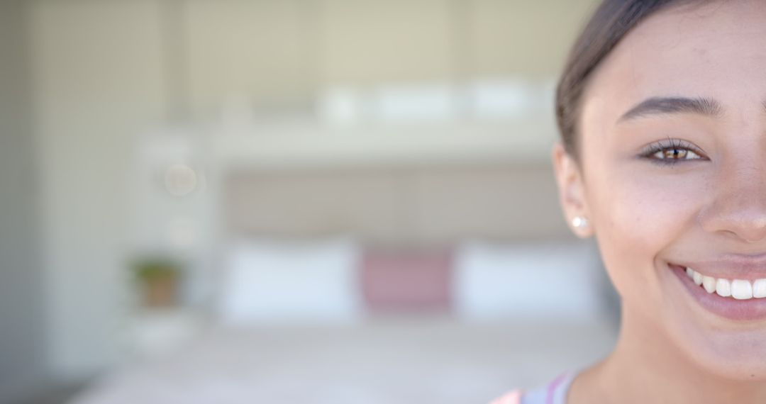 Smiling Woman in Bedroom Creating Warm Atmosphere