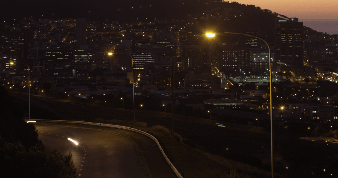 Low Light Urban Landscape City Lights and Traffic at Night Transparent Glow