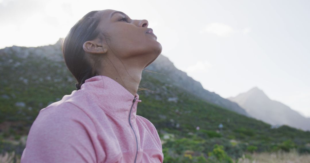 Athletic Woman Breathing Deeply During Outdoor Exercise in Mountains - Free Images, Stock Photos and Pictures on Pikwizard.com