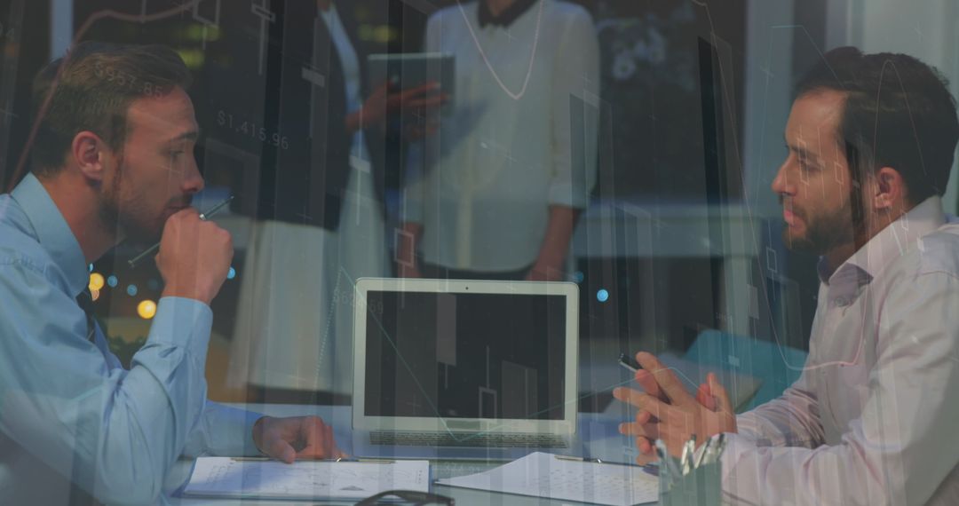 Businessmen Analyzing Data and Shaking Hands in Office