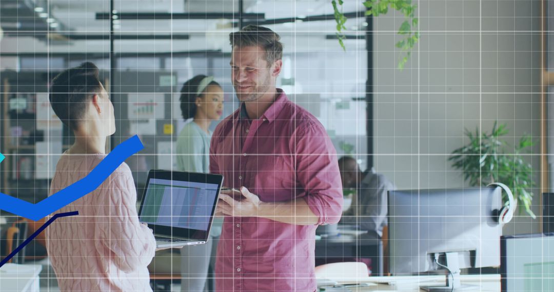 Colleagues Collaborating in Modern Office with Digital Graph Overlay