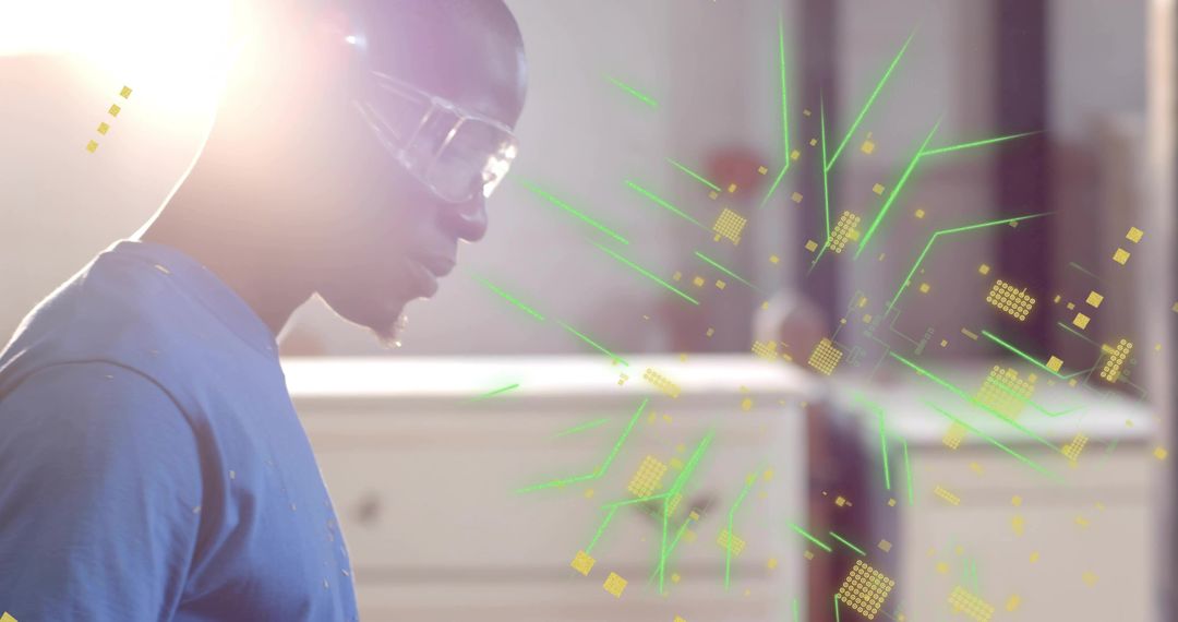 Technician wearing safety goggles examining holographic interface with neon green data