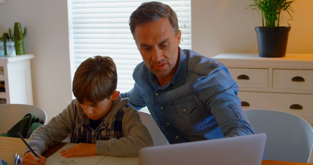 Father Helping Son with Homework in Home Office - Free Images, Stock Photos and Pictures on Pikwizard.com