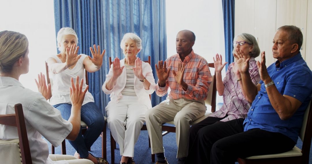 Senior Adults Participating in Chair Yoga Class at Wellness Center - Free Images, Stock Photos and Pictures on Pikwizard.com