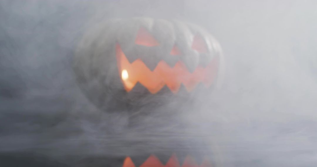 Glowing Jack-o-Lantern Emerging Through Fog, Candlelight Reflection on Surface