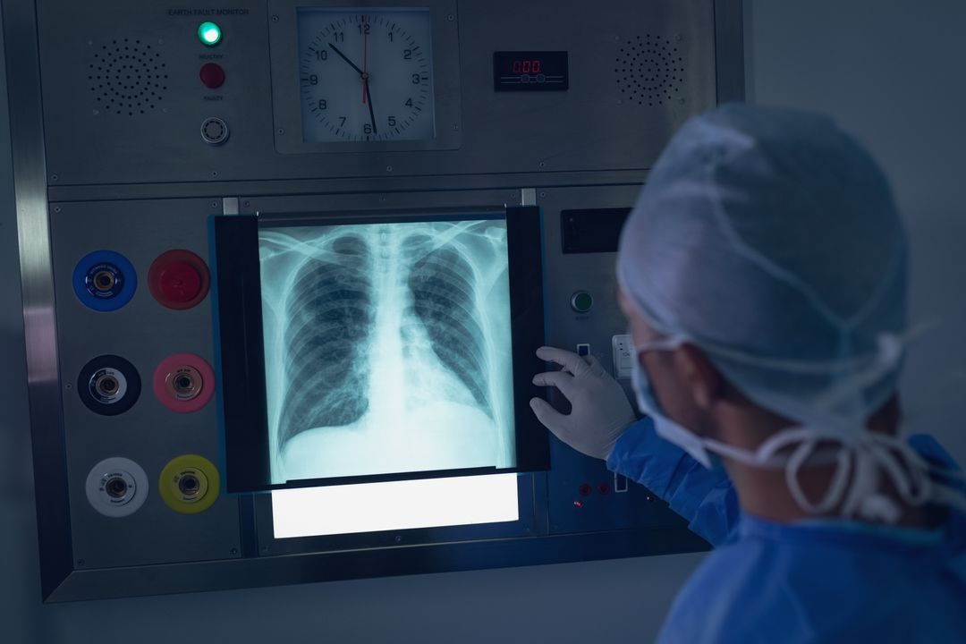 Surgeon Examining Chest X-Ray in Hospital - Free Images, Stock Photos and Pictures on Pikwizard.com