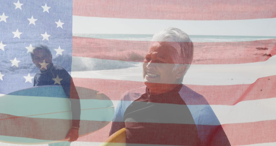 Senior Couple Surfing Against American Flag Backdrop at the Beach