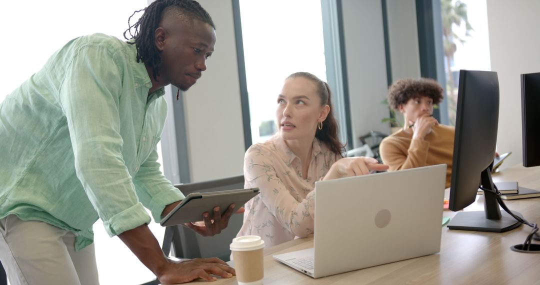 Office Team Collaborating on Project with Technology and Gadgets