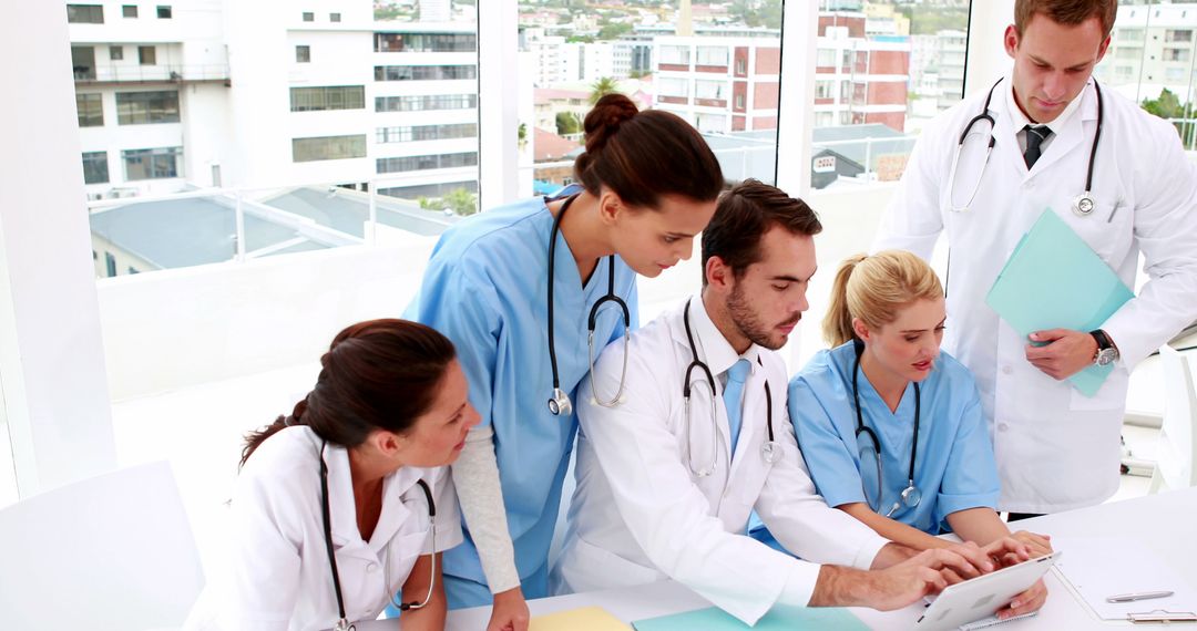 Medical Team Discussing Patient Data in Modern Hospital - Free Images, Stock Photos and Pictures on Pikwizard.com