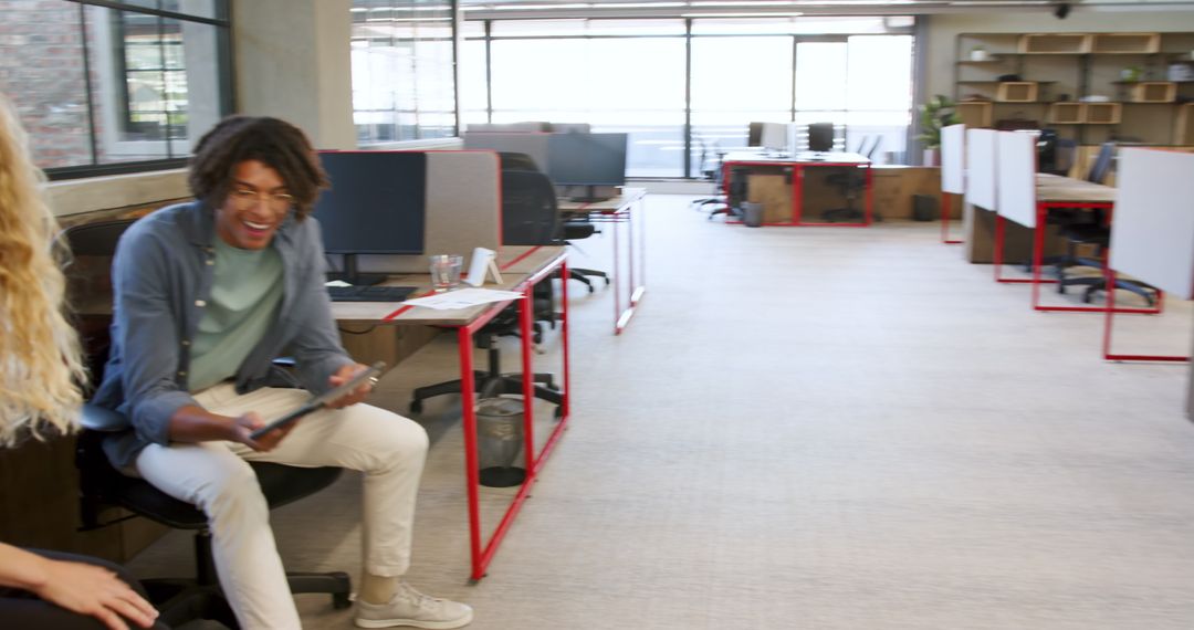 Colleagues Discussing Project Planning in Modern Office Environment