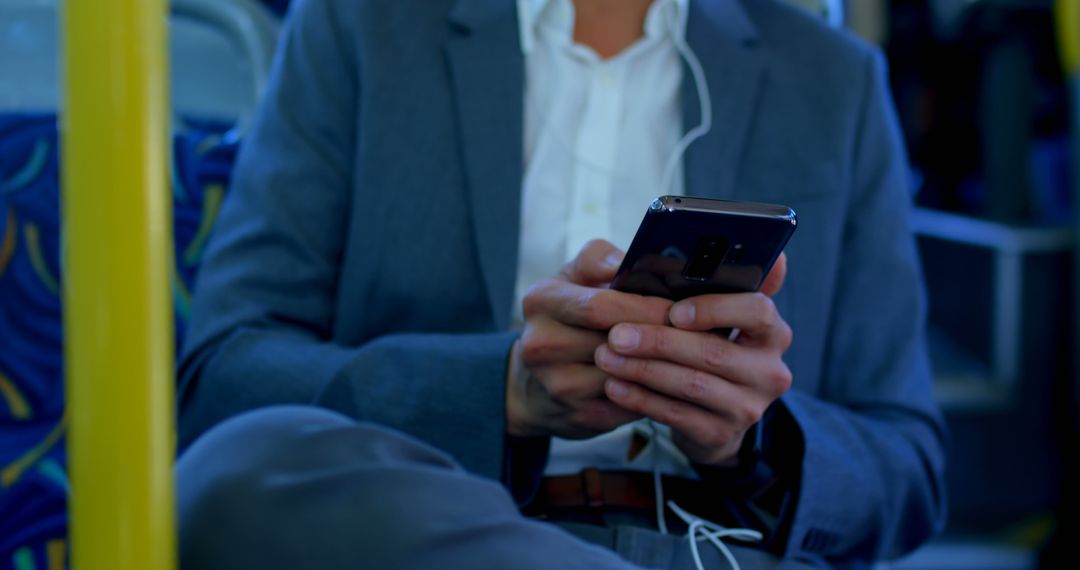 Businessman Checking Smartphone on City Bus Commute