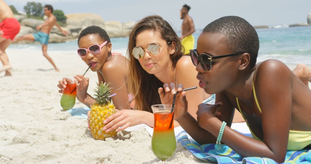 Friends Relaxing with Tropical Drinks on Sunny Beach Getaway