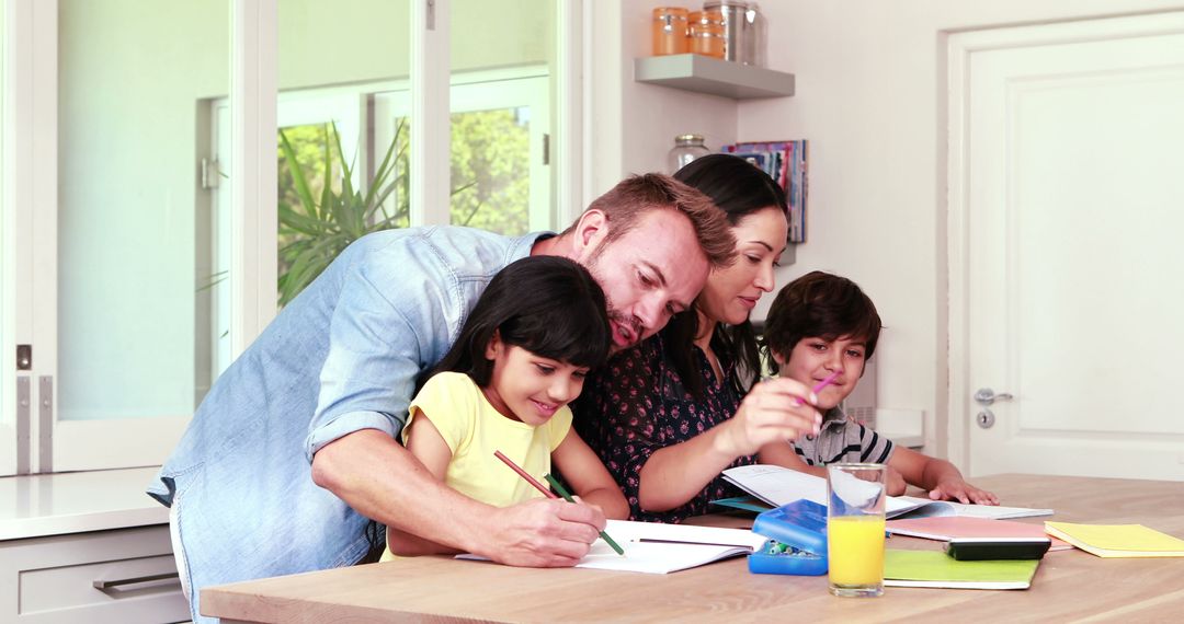 Parents Helping Children with Homework at Kitchen Table - Free Images, Stock Photos and Pictures on Pikwizard.com