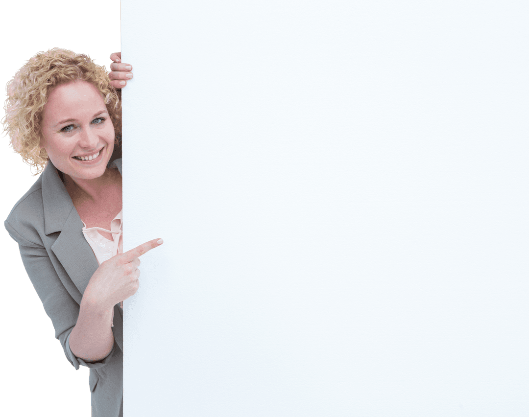 Happy Woman with Curly Hair Pointing Behind Transparent Panel