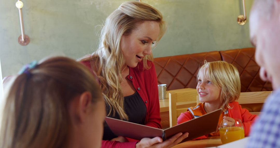 Mother Reading Menu to Children in Restaurant - Free Images, Stock Photos and Pictures on Pikwizard.com