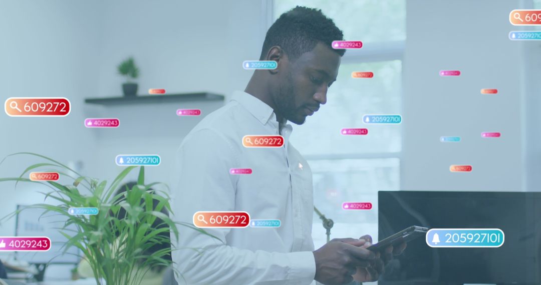 Businessman Using Tablet with Social Media Overlays in Modern Office