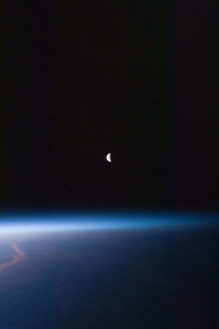 Last Quarter Moon over Earth's Atmosphere from Space Station - Free Images, Stock Photos and Pictures on Pikwizard.com
