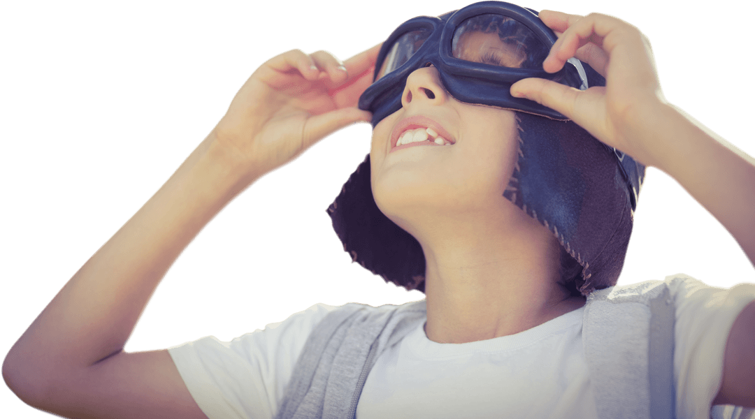 Joyful Child Imagining Flying Adventure with Transparent Goggles