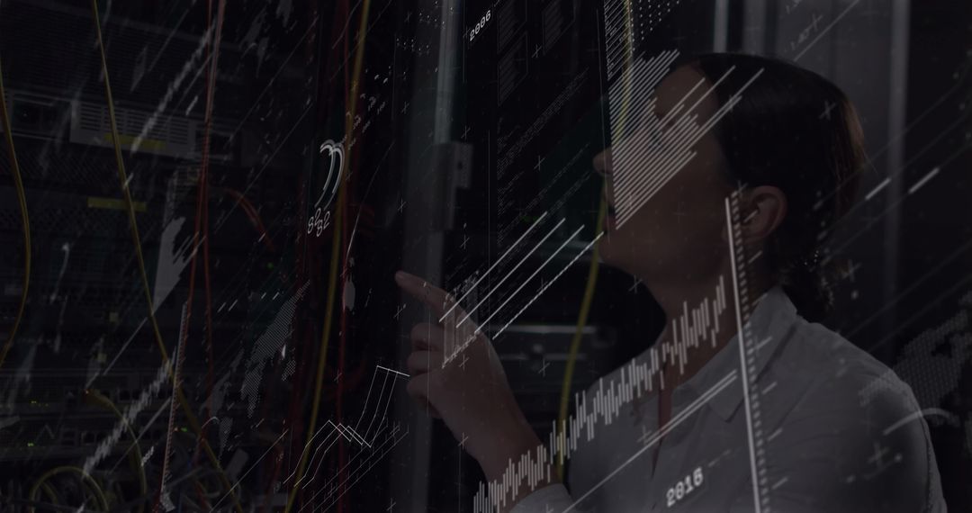 IT Technician Analyzing Server Racks for Network Security Optimization