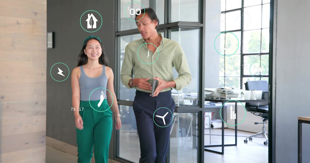 Walking coworkers collaborating with mobile HUD overlays in modern glass office corridor